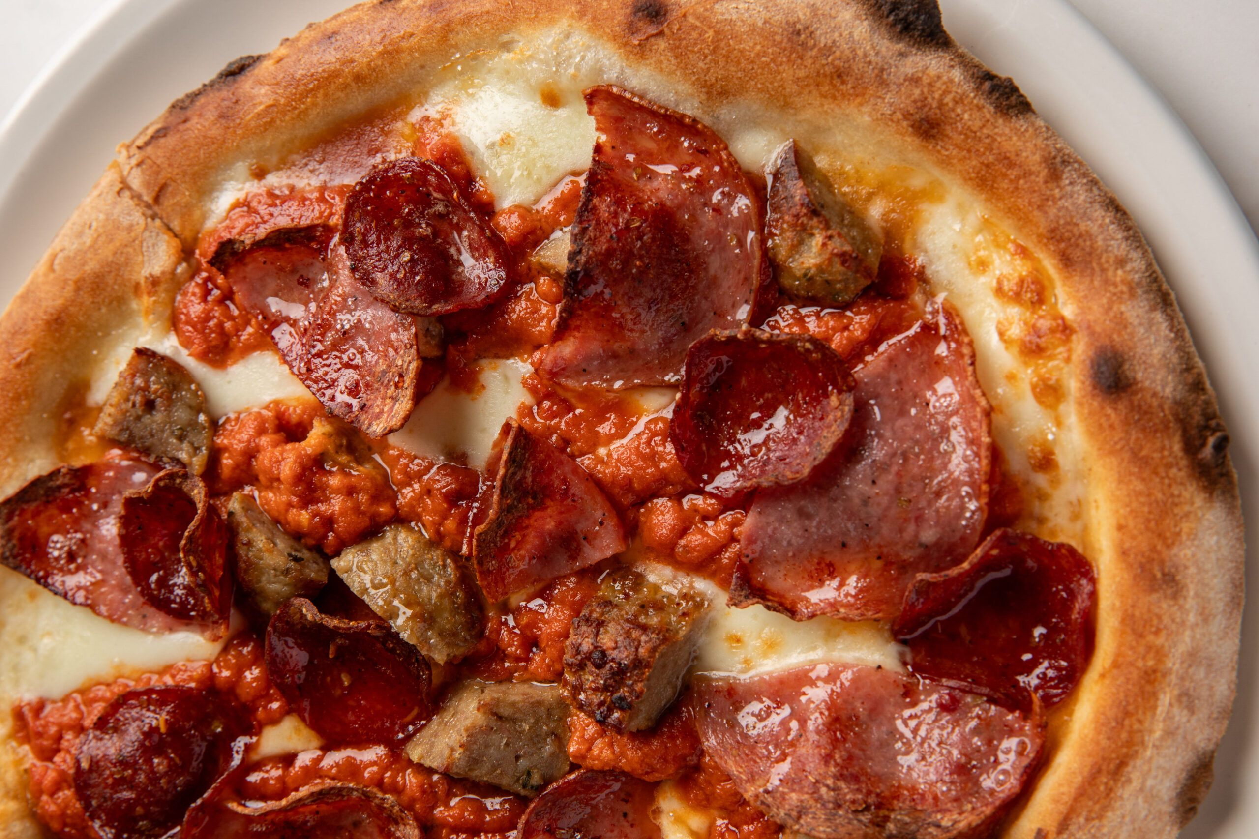 Quattro Carni, a oven-baked pizza at Capolinea